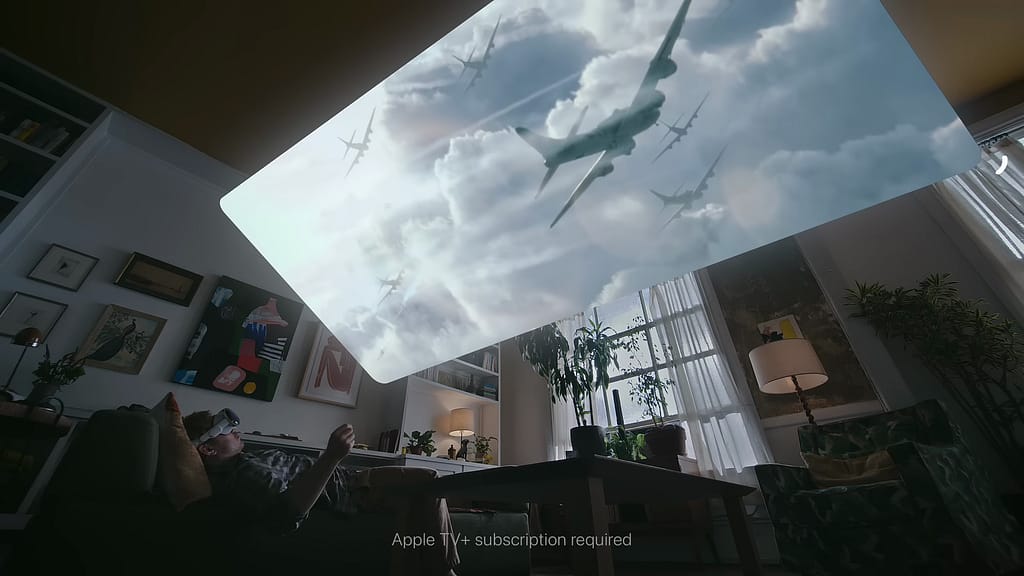 A man wearing a VR headset lying on a couch, watching a TV show projected on his ceiling