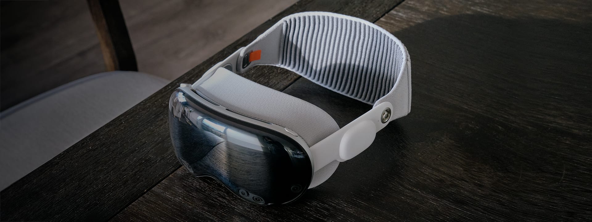 Apple Vision Pro virtual reality headset sitting on a table